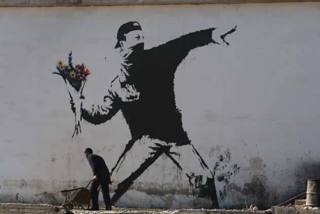 Graffiti "Homme au bouquet de fleurs" par Banksy